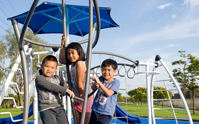 Kids playing on park equipment